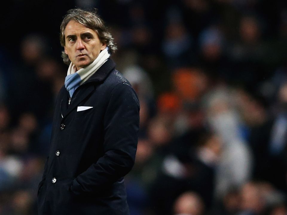 MANCHESTER, ENGLAND - MARCH 09:  Roberto Mancini, manager of Manchester City looks on during the FA Cup sponsored by Budweiser Sixth Round match between Manchester City and Barnsley at Etihad Stadium on March 9, 2013 in Manchester, England.  (Photo by Matthew Lewis/Getty Images)