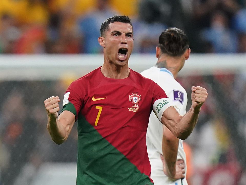 Portugal's Cristiano Ronaldo celebrates after team-mate Bruno Fernandes scores their side's first goal of the game during the FIFA World Cup Group H match at the Lusail Stadium in Lusail, Qatar. Picture date: Monday November 28, 2022.
