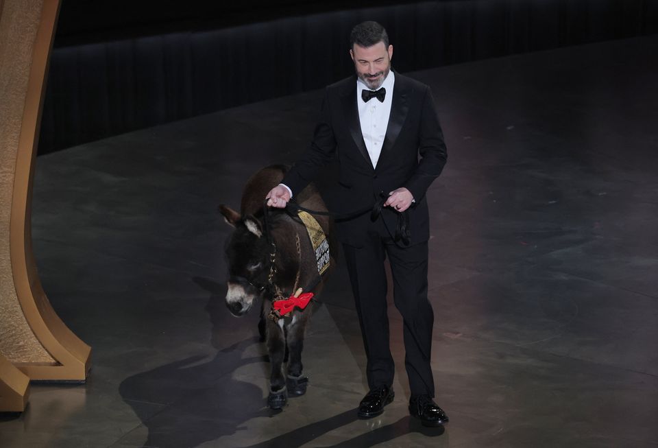 Host Jimmy Kimmel brings out Jenny the donkey during the Oscars show at the 95th Academy Awards in Hollywood, Los Angeles, California, U.S., March 12, 2023. REUTERS/Carlos Barria