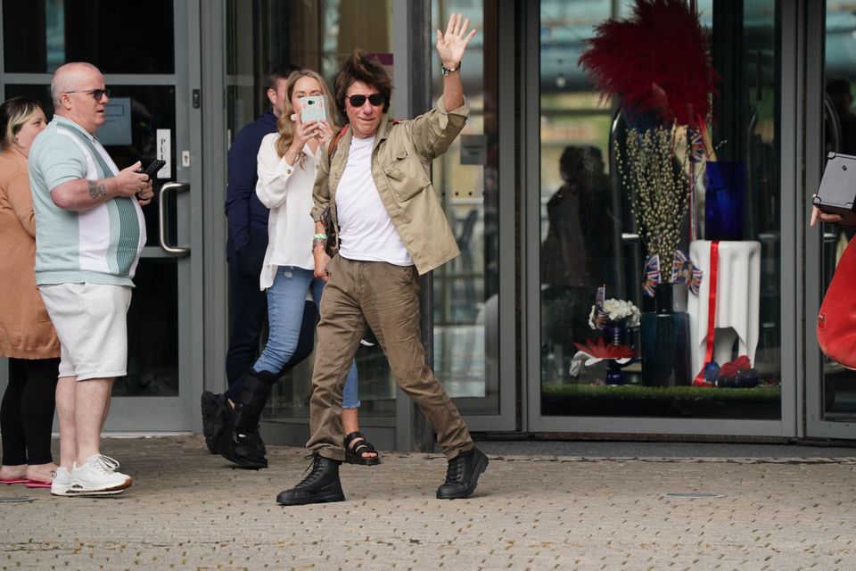 Jeff Beck waves as he leaves the Hilton Newcastle Gateshead Hotel, where it is believed actor Johnny Depp is staying (Owen Humphreys/PA)