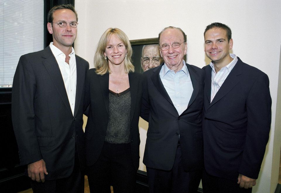 Rupert pictured with his three children, who all work in his media empire