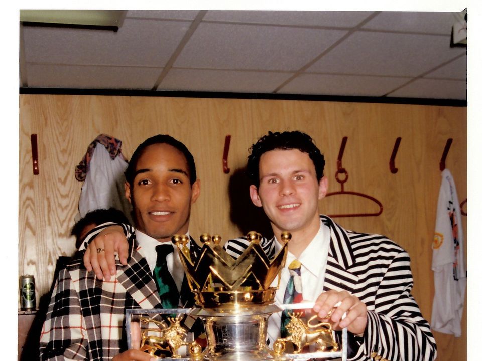 Ryan Giggs and Paul Ince pose with the Premiership trophy in 1993