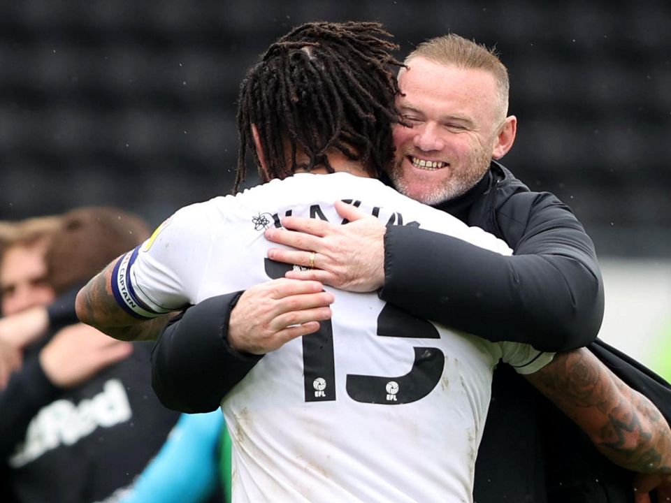 Derby County manager Wayne Rooney celebrates after the match with Colin Kazim-Richards. Action Images via Reuters/Molly Darlington