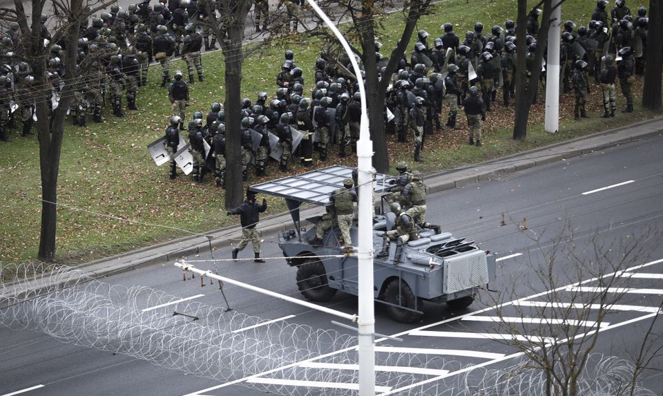 Police set up a roadblock during a rally in Minsk (AP)