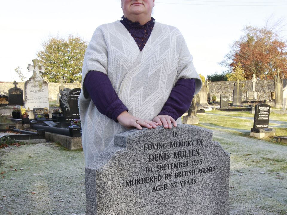Denise Mullen at her fathers grave.
