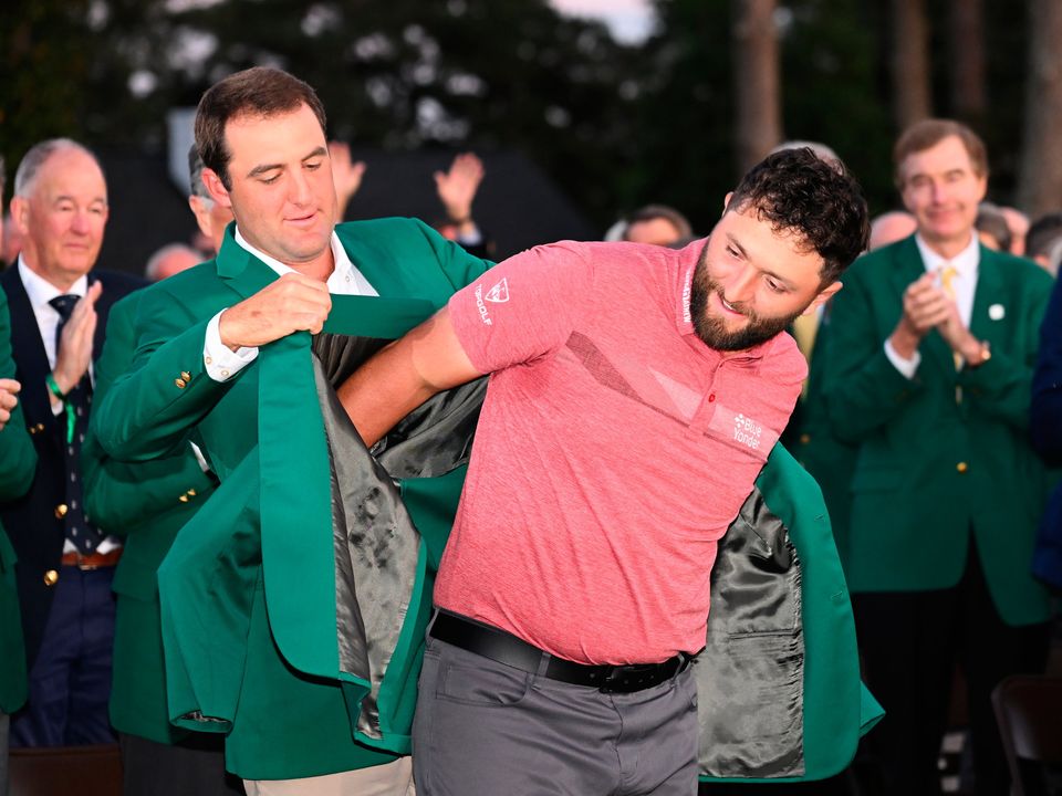 John Rahm tries on his Masters jacket for size