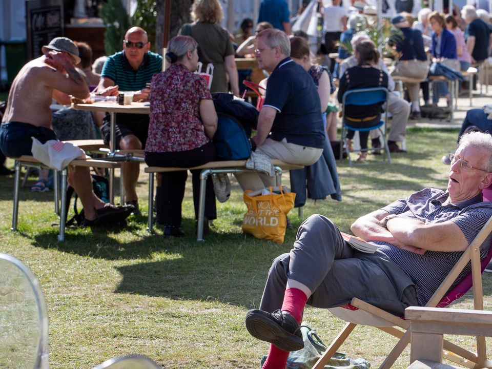 Visitors enjoy the sunshine at the book festival in Charlotte Square Gardens in 2019 (Jane Barlow/PA)