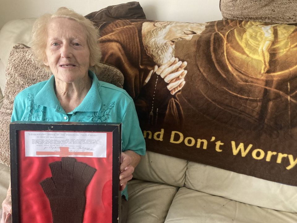 Nelly Cosgrave (92), from Ballybrown, Co Limerick, photographed here holding a glove with alleged healing powers that was worn by the late Italian saint, Padre Pio. Ms Cosgrave is one of two women who said they believe they saw an apparition of St Padre Pio, at St Saviour’s Church, Limerick Dominicans, during a mass last Friday which marked the 52nd anniversary of St Pio’s death. Photo Brendan Gleeson