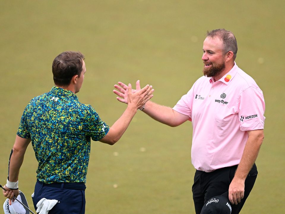 Shane Lowry of Ireland shakes hands with Jordan Spieth of the United States on the 18th green during the second round of the 2023 PGA Championship at Oak Hill Country Club on May 19, 2023 in Rochester, New York. (Photo by Ross Kinnaird/Getty Images)