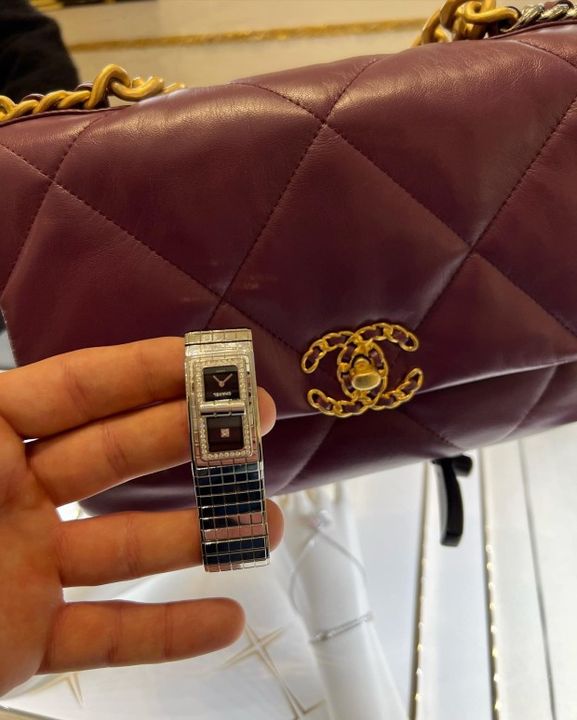 Dee's new Chanel watch and handbag