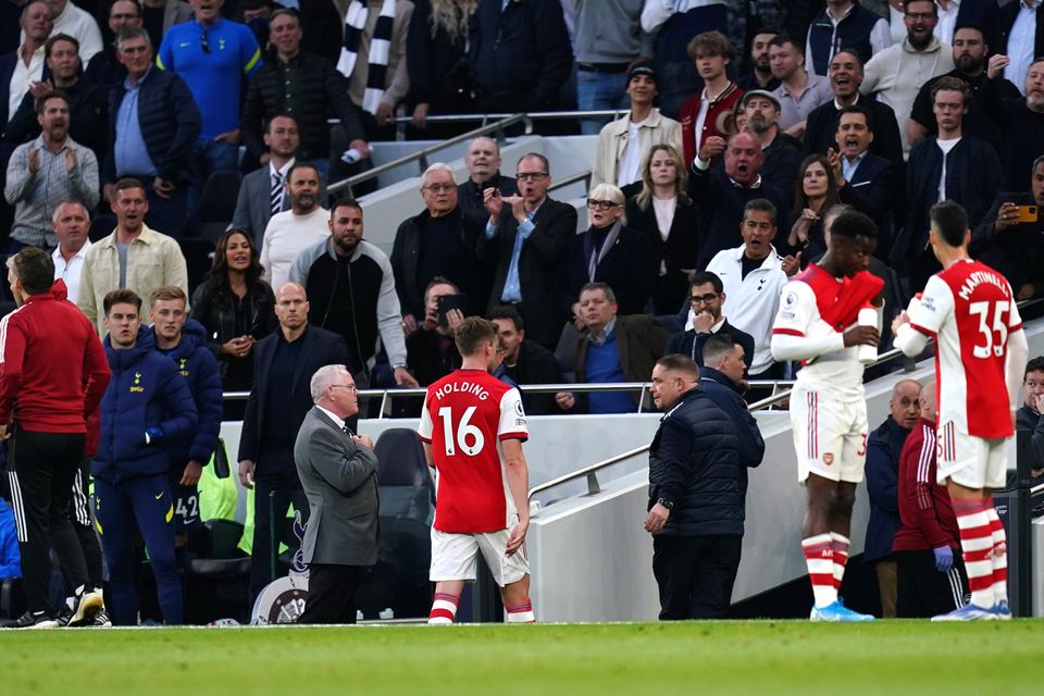 Arsenal’s Rob Holding leaves the pitch after his red card (John Walton/PA).