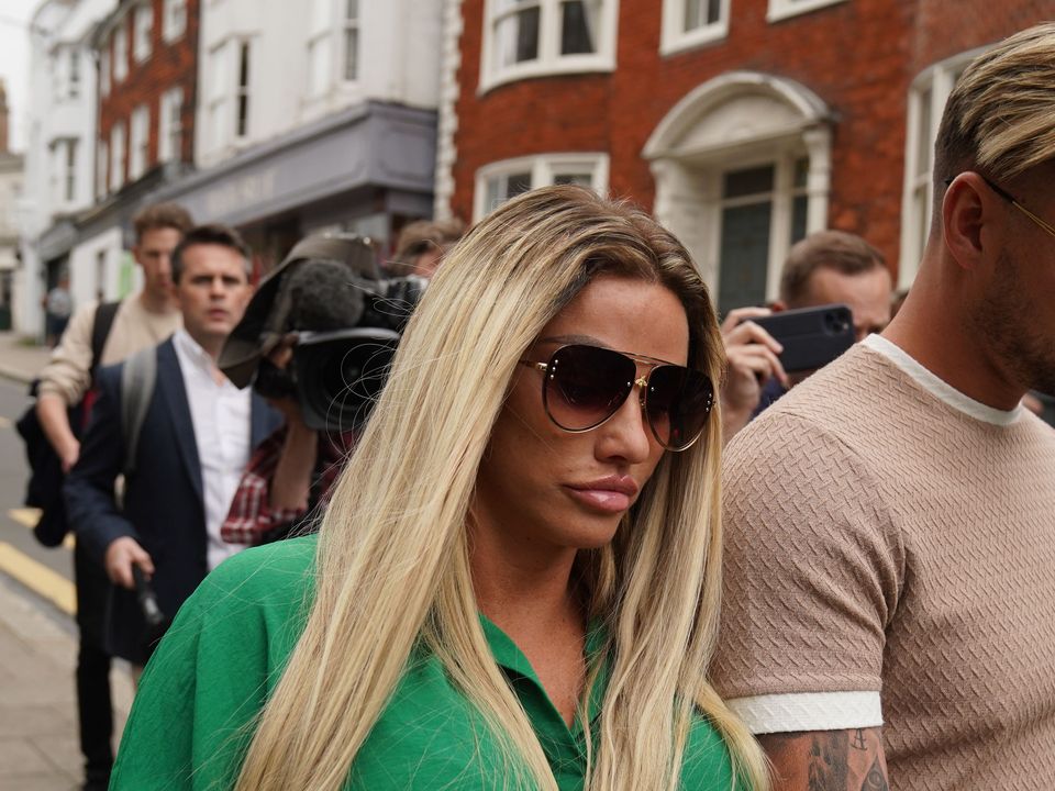 Katie Price leaves Lewes Crown Court with Carl Woods (Gareth Fuller/PA)