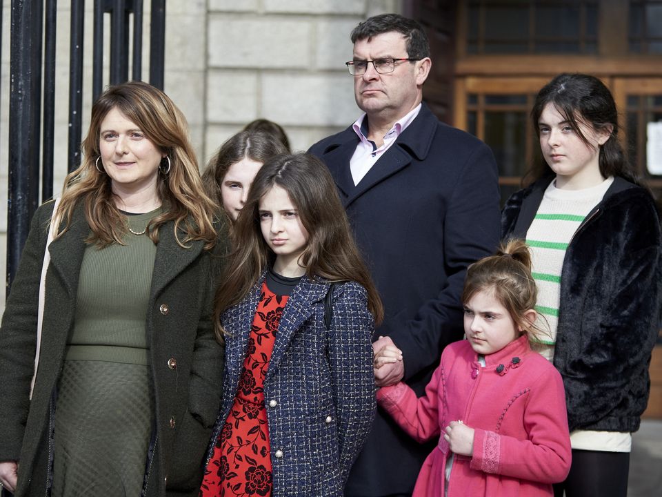 Rebecca Collins and her family outside the High Court this week. Photo: The Pudding