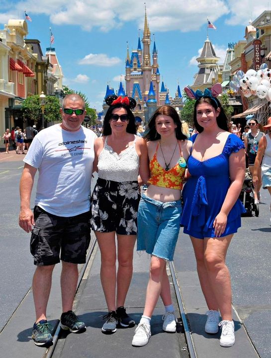 Shannon with her family at Walt Disney World Resort in Florida
