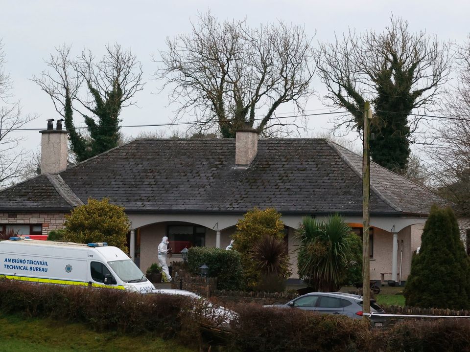 Forensic officers at a house in Castleblayney, Co Monaghan, where the body of a man was discovered. Photo: Liam McBurney
