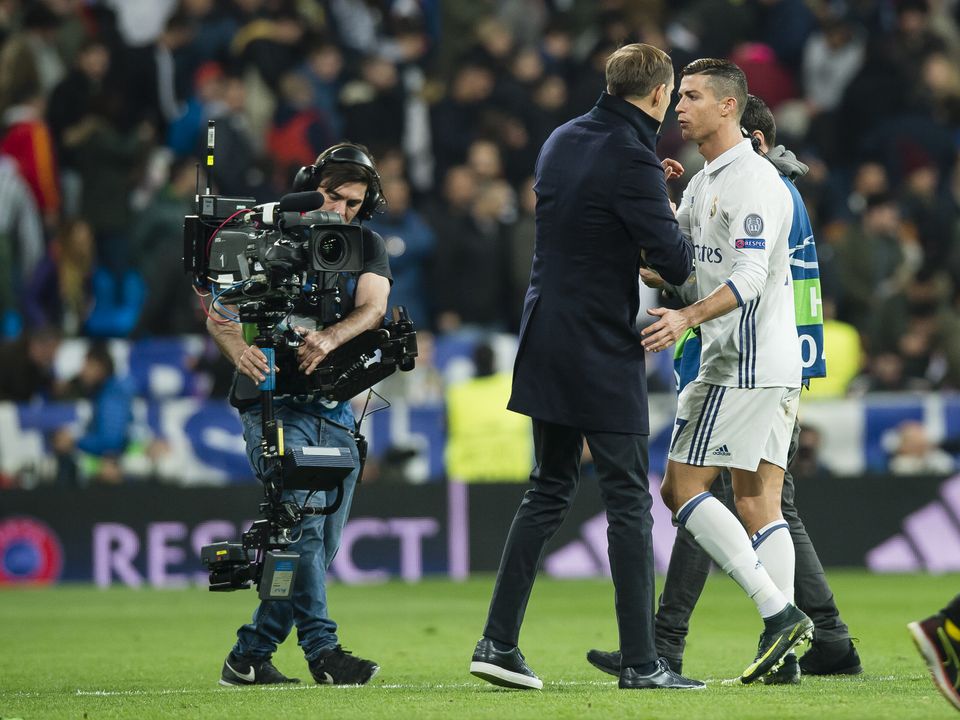 MADRID, SPAIN - DECEMBER 07: Head coach Thomas Tuchel of Borussia Dortmund together with Christiano Ronaldo of Real Madrid CF after the final whistle during the UEFA Champions League: First Qualifying Round 2nd Leg match between Real Madrid CF and Borussia Dortmund at Estadio Santiago Bernabeu on December 07, 2016 in Madrid, Spain.  (Photo by Alexandre Simoes/Borussia Dortmund via Getty Images)