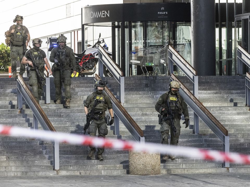Police are seen outside the Field's shopping center in Copenhagen, Denmark