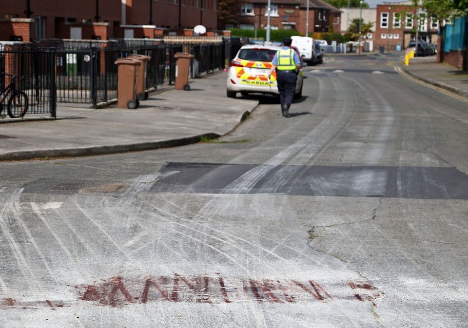 Blood is visible on the road as gardaí continue their investigations into the gangland shooting on Knocknarea Road, Drimnagh. Photo: Collins