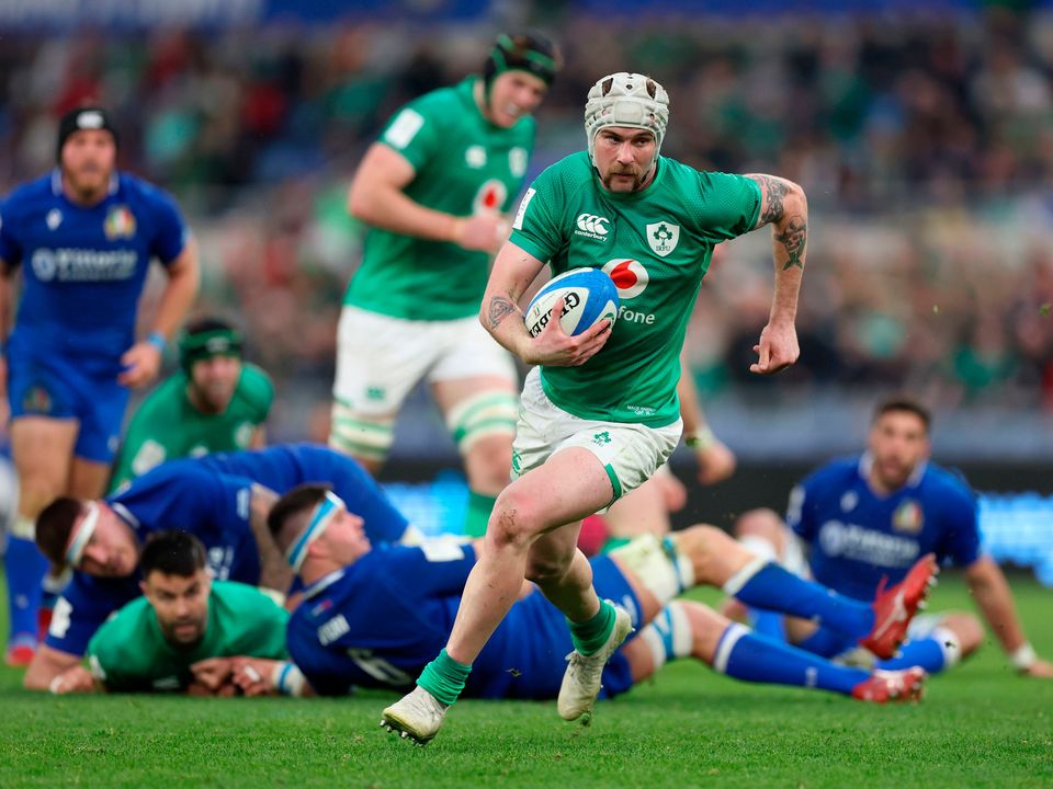 Ireland's Mack Hansen on his way to scoring their side's fifth try during the Guinness Six Nations match at the Stadio Olimpico in Rome, Italy. Picture date: Saturday February 25, 2023. PA Photo. See PA story RUGBYU Ireland. Photo credit should read: Steven Paston/PA Wire.

RESTRICTIONS: Use subject to restrictions. Editorial use only, no commercial use without prior consent from rights holder.