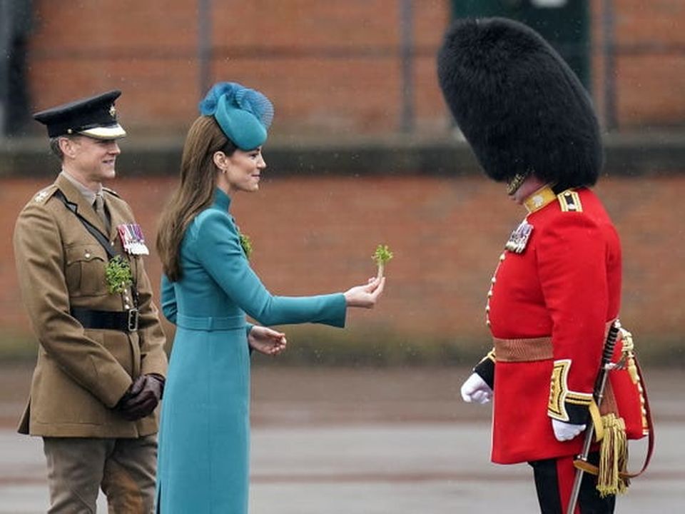 The Princess of Wales presents the traditional sprigs of shamrock to officers and guardsmen during a visit to the 1st Battalion Irish Guards at Mons Barracks in Aldershot for the St Patrick’s Day Parade (Andrew Matthews/PA)