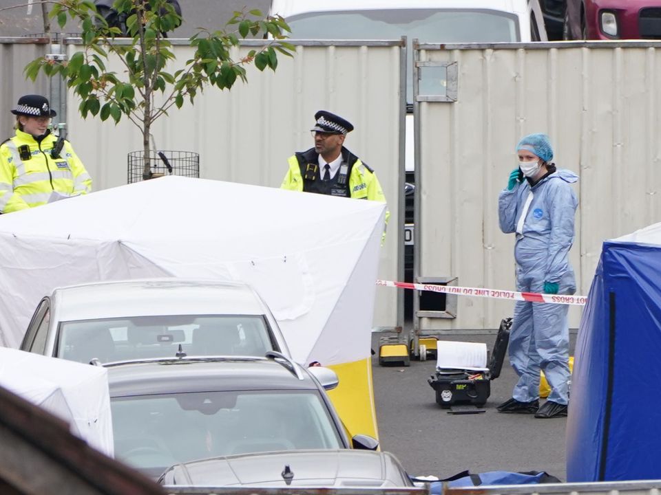 Police forensic tents outside a house in Bermondsey, south-east London, after three women and a man were stabbed to death in the early hours of Monday (Kirsty O’Connor/PA)