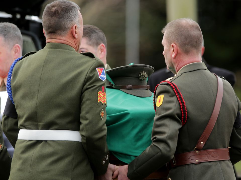 The remains of Acting Sergeant Major Declan O'Connell arrive for funerl mass in St Brigids Church in the Curragh Camp . Picture; Gerry Mooney