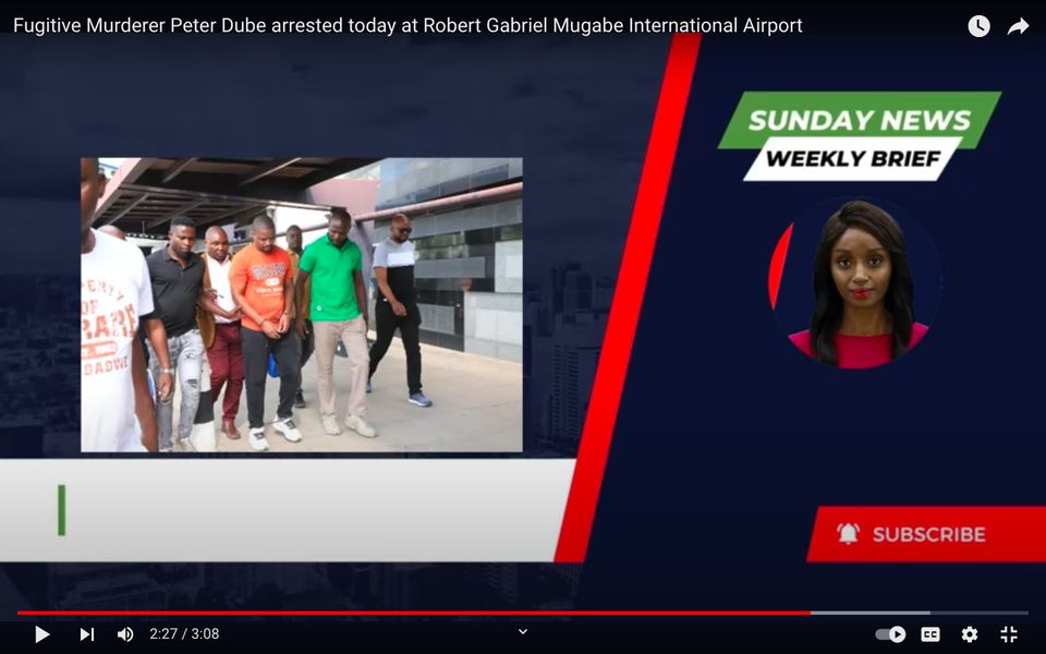Dube is led away after his arrest