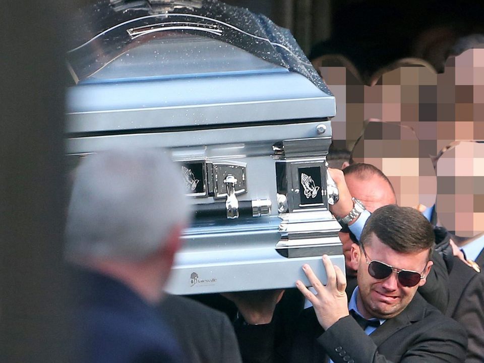 Liam Byrne carrying the coffin of his brother, David, who was killed in the Regency Hotel