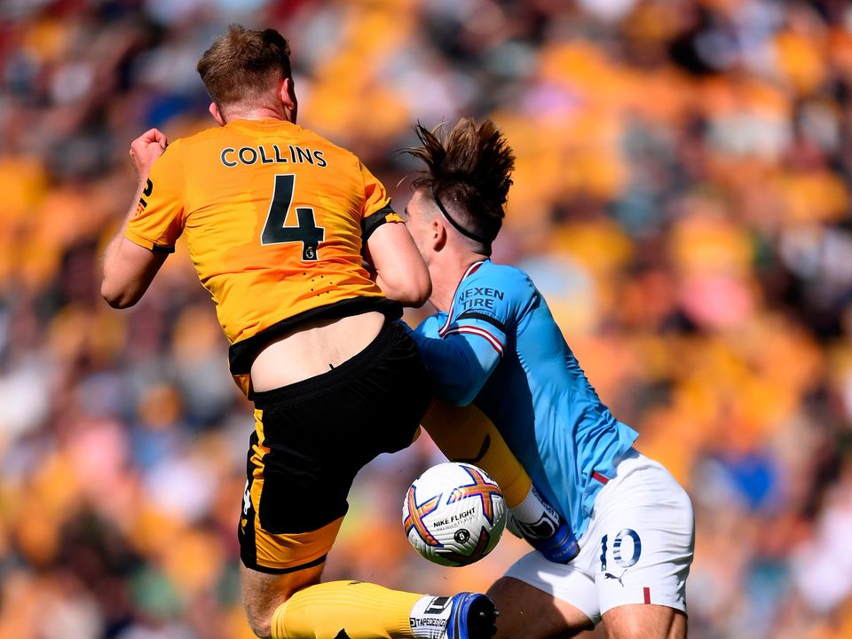 Wolves defender Nathan Collins takes out Jack Grealish