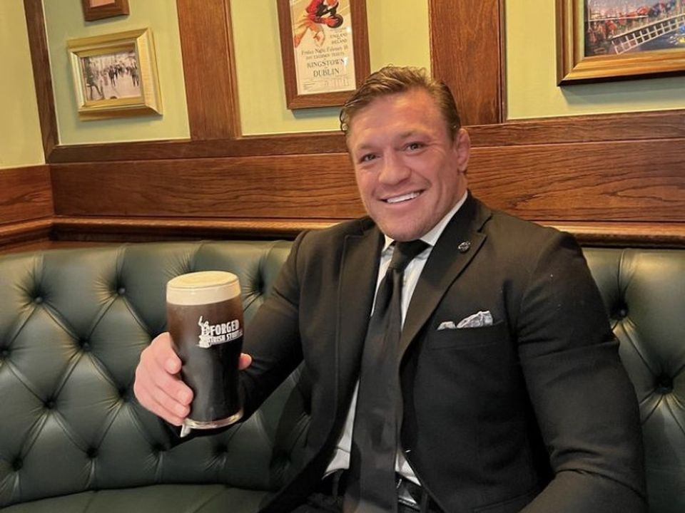 McGregor poses with a pint in his Crumlin pub. Instagram / @thenotoriousmma