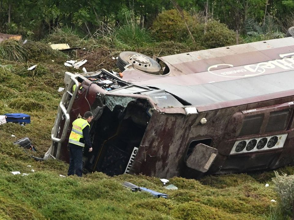 A school bus carrying 27 female students veered off the motorway after a crash with a truck (Image: AAP/PA Images)