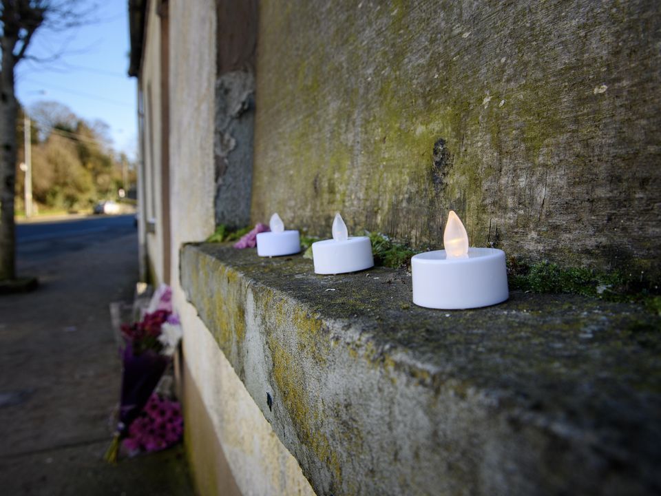 Candles at the scene of the boarded-up vacant house on Beecher street, Mallow, Co. Cork where Mr O'Sullivan's body was discovered. (Pic Daragh Mc Sweeney/Provision)