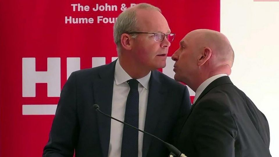Irish Foreign Minister Simon Coveney being told to evacuate the north Belfast building last week