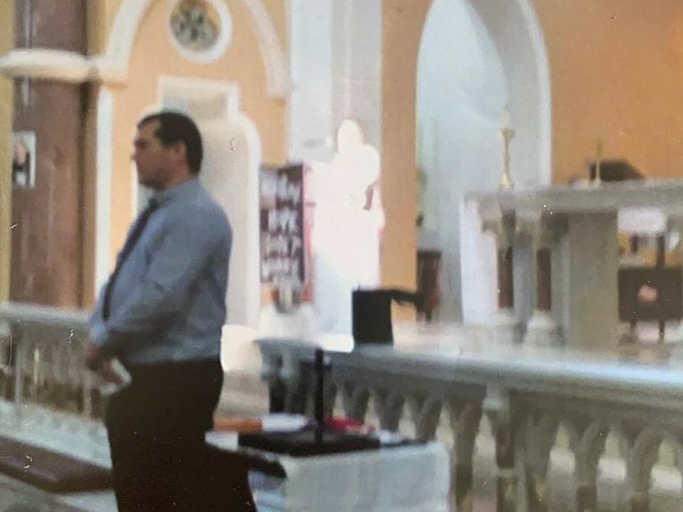 A bright light, which some believe to be an apparition of the dead Italian saint Padre Pio, photographed during a mass held in St Saviour’s Church, Limerick, on September 23, 2018, marking the 50th anniversary of the death of Saint Padre Pio. Will Stokes, Limerick, who was volunteering on the day, appears in the foreground of the photograph. Two women have said they saw the photograph, which was erected in St Saviour’s Church last Friday, marking the 52nd anniversary of the saint’s death, change colour and reveal St Pio in a brown coloured habit.