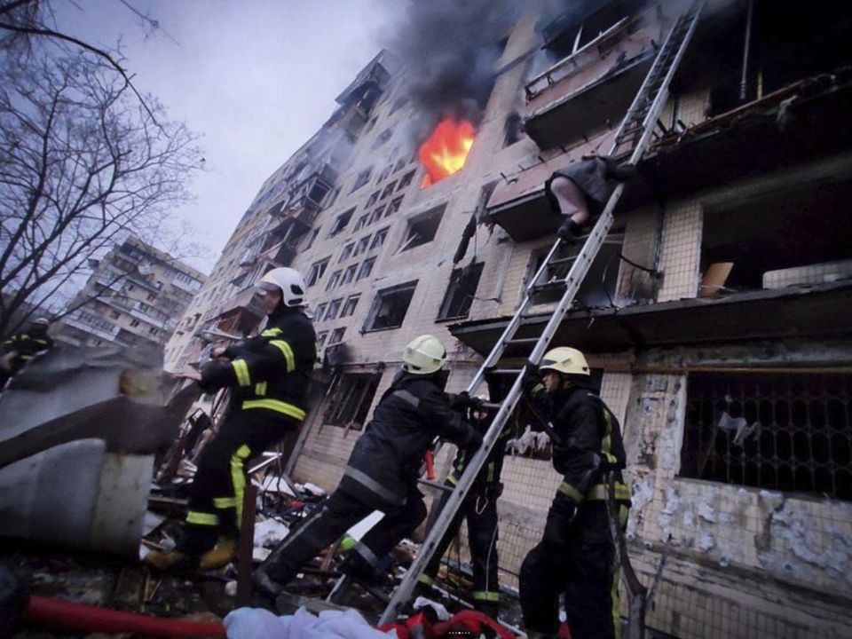 Firefighters work at an apartment building hit by shelling in Kyiv (Ukrainian State Emergency Service via AP)