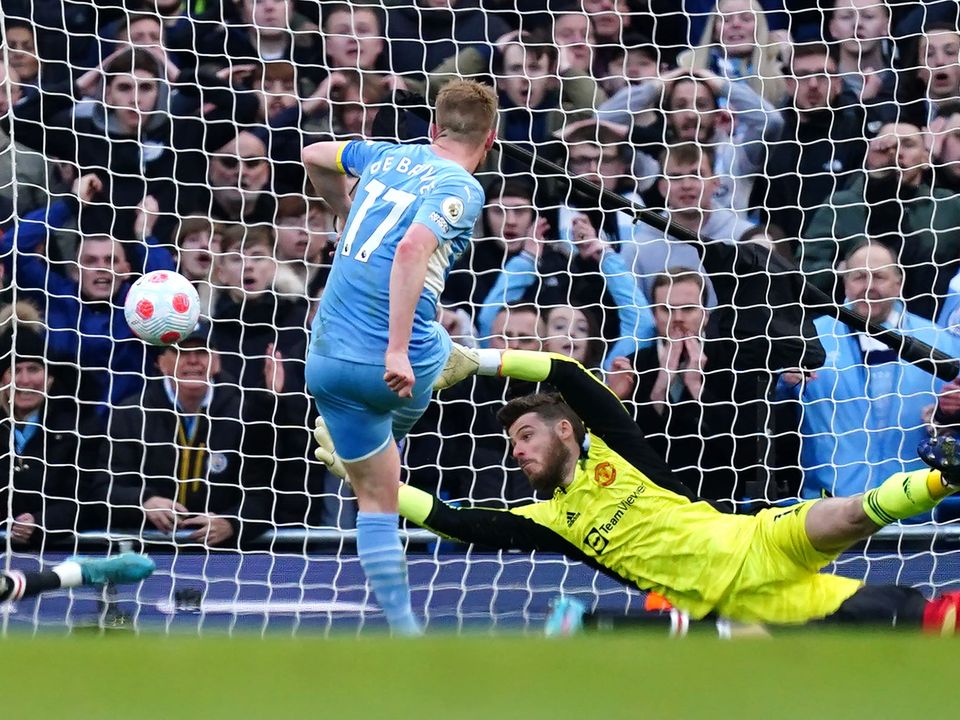 Manchester City’s Kevin De Bruyne (centre left) scores their side’s second goal of the game during the Premier League match at the Etihad Stadium, Manchester. Picture date: Sunday March 6, 2022.