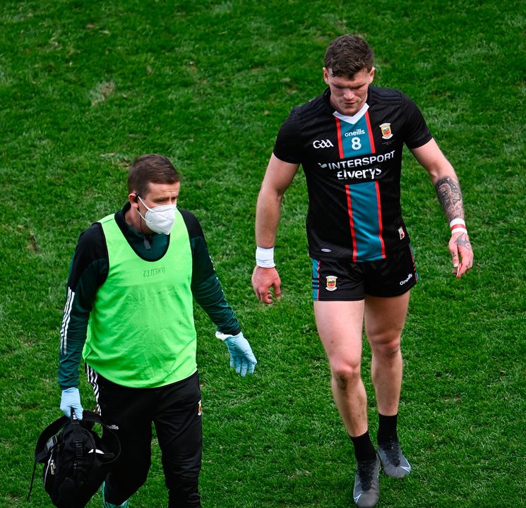 Jordan Flynn of Mayo leaves the pitch to receive medical attention for an injury during the Allianz Football League Division 1 final defeat to Kerry at Croke Park in Dublin. Photo by Piaras Ó Mídheach/Sportsfile