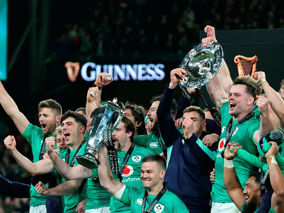 DUBLIN, IRELAND - MARCH 18: Johnny Sexton of Ireland lifts the Six Nations Trophy as James Ryan of Ireland lifts the Triple Crown Trophy after winning the Six Nations with a Grand Slam during the Six Nations Rugby match between Ireland and England at Aviva Stadium on March 18, 2023 in Dublin, Ireland. (Photo by David Rogers/Getty Images)
