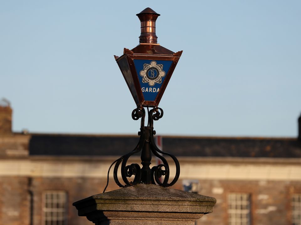 The Garda logo on a lamp at the entrance to Garda Headquarters in the Phoenix Park, Dublin.