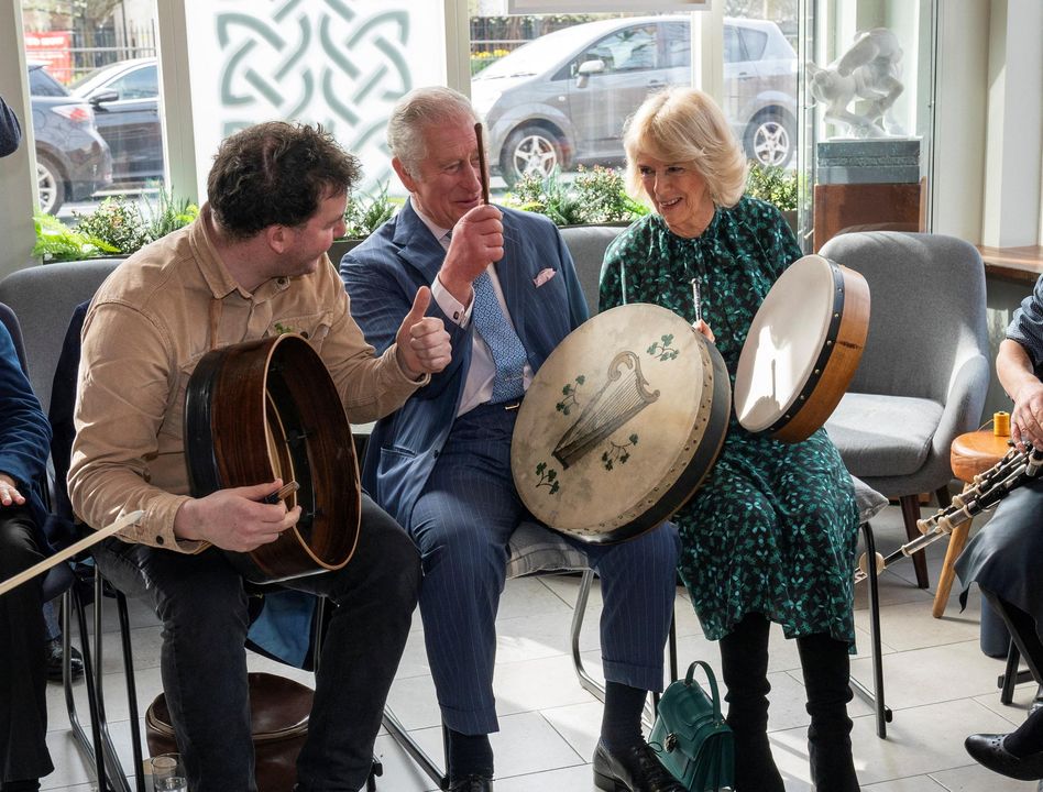 Prince Charles and Camilla have a go at the bodhrán during St Patrick’s Day celebrations in London last week. Photo: Arthur Edwards/Pool