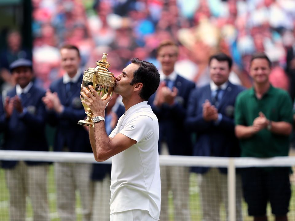 File photo dated 16-07-2017 of Roger Federer with the trophy after beating Marin Cilic in the Gentlemen's Singles Final. Roger Federer has announced he will retire from professional tennis after the Laver Cup. Issue date: Thursday September 15, 2022.