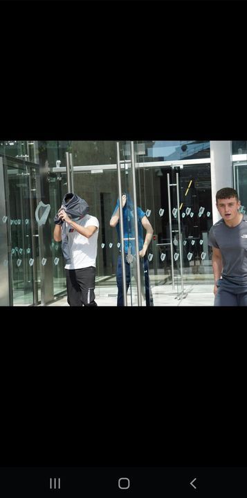 Glen Ward (left) Eric O'Driscoll (centre back) and Darragh Collopy (right) outside the Criminals Courts of Justice in Dublin
