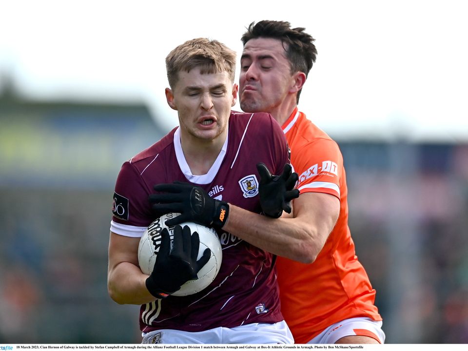 Cian Hernon of Galway is tackled by Stefan Campbell of Armagh, in a game in which the Orchard County only got two points in the second half. Photo: Ben McShane/Sportsfile