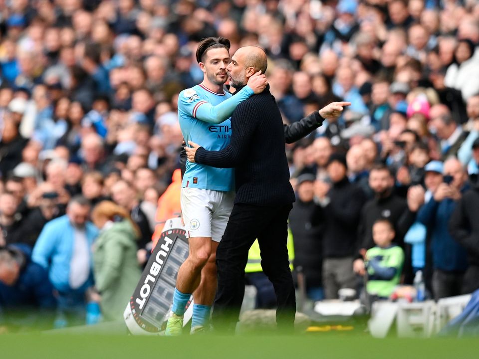 Jack Grealish is embraced by Pep Guardiola, Manager of Manchester City, after a brilliant display against Liverpool. Photo by Michael Regan/Getty Images