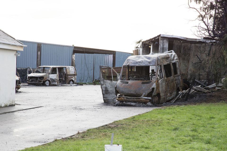 Burnt-out vehicles at the repossessed home of Michael Anthony McGann near Strokestown, Co Roscommon. Photo: Colin O'Riordan