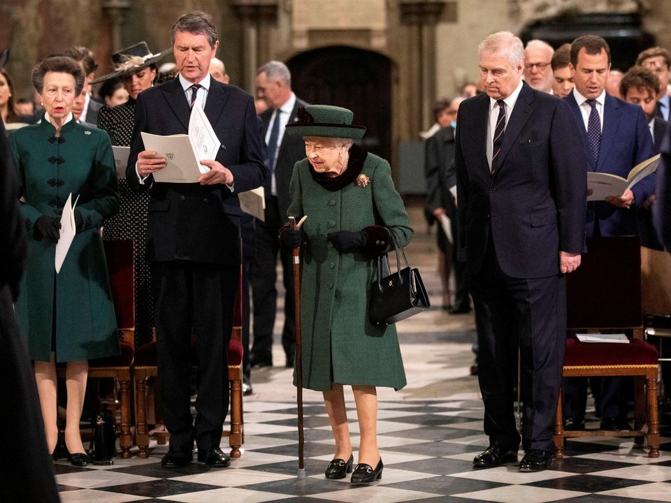 Britain's Queen Elizabeth, accompanied by Prince Andrew, attends a service of thanksgiving for late Prince Philip, Duke of Edinburgh, at Westminster Abbey Photo: Richard Pohle/Pool via REUTERS/File Photo