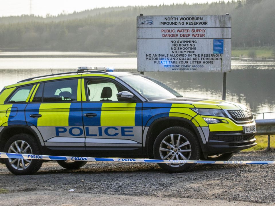 PSNI at the entrance to North Woodburn Reservoir on the outskirts of Carrickfergus (Liam McBurney/PA)