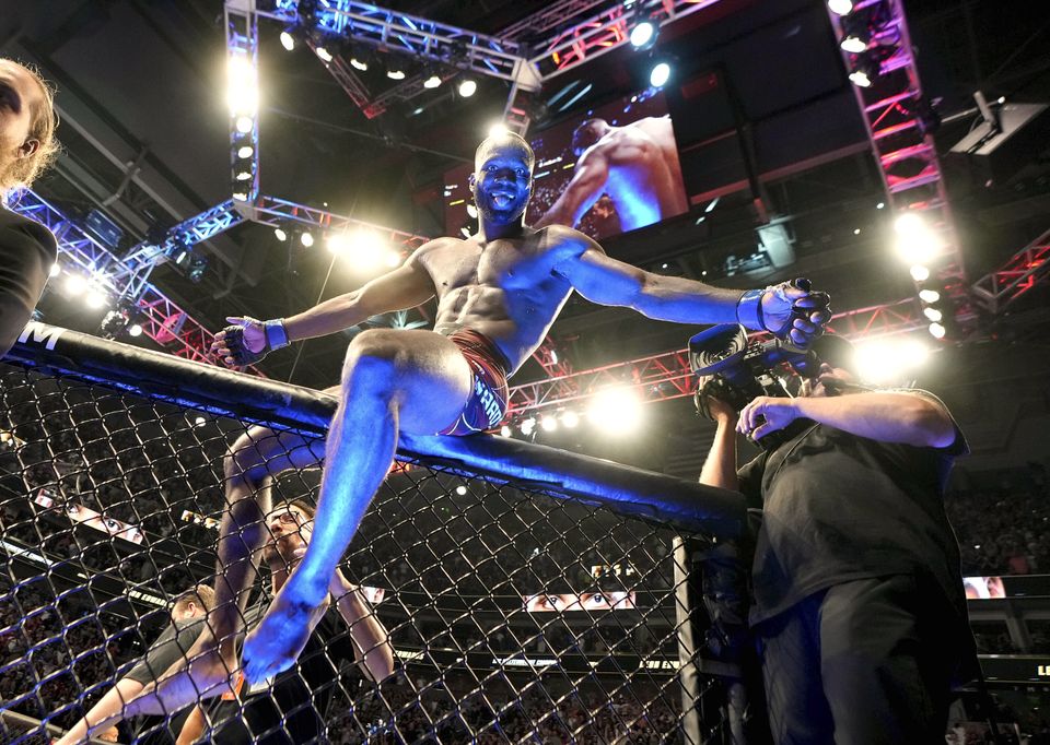 UFC fighter Leon Edwards, of Jamaica, celebrates his title as welterweight champion of the world. (Francisco Kjolseth/The Salt Lake Tribune via AP)