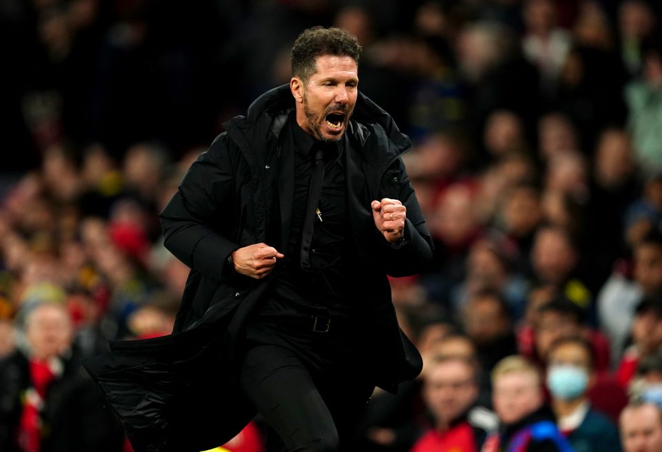 Atletico Madrid boss Diego Simeone runs off in celebration after beating Manchester United (Martin Rickett/PA)
