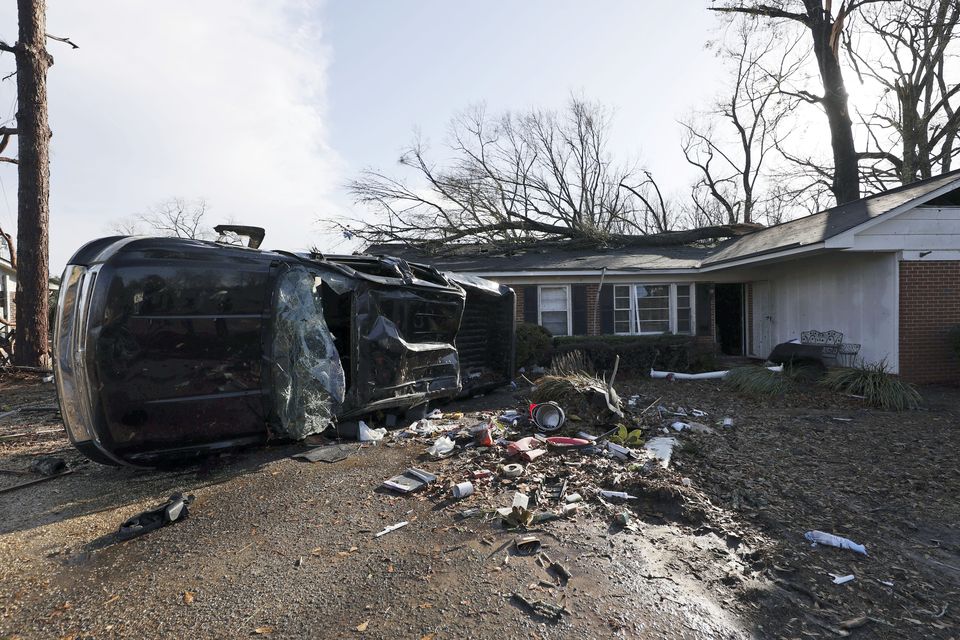 A vehicle is upended and debris is strewn about follow a tornado near Meadowview elementary school Wednesday, Jan. 12, 2023 in Selma Ala. (AP Photo/Butch Dill)